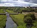 The Tame at Ray Hall sewage works, from the Tame Valley Canal aqueduct, with the Charlemont area of West Bromwich on the right.