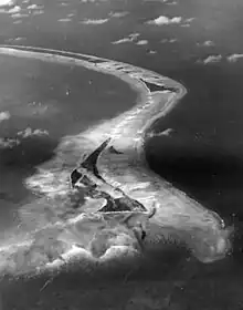 Aerial view of Betio Island looking east, before invasion of the island by U.S. Marines, 18 September 1943. The image was taken by an aircraft from Composite Squadron 24.