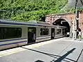 A train at the station in May 2012 with one coach inside the tunnel