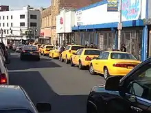 Taken on March 1, 2014.  Taxis waiting to pick up passengers with large packages in the Getty Square Shopping District, Yonkers, New York.