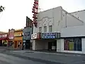 A replica marquee, added c. 2006, and restored facade in 2008