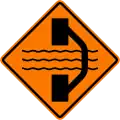 Bridge out ahead with a temporary bridge on a detour on right