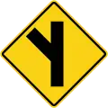 Skewed side road junction on left