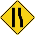 Road narrows on right side