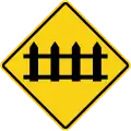 Railway crossing ahead with gates