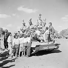 Indian Universal Carrier crew play with children in Cyprus