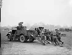 Loading a Hotchkiss 25mm SA 34 anti-tank gun onto the back of a Bedford MWG, April 1940