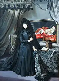 A widow draped in mourning points to a portrait of her husband's remains, which are embellished with the regalia of his realm.