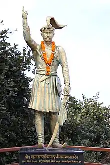 Statue of Prithvi Narayan Shah located behind the temple