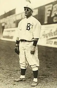 Stengel stands in the outfield, playing his position and wearing sunglasses