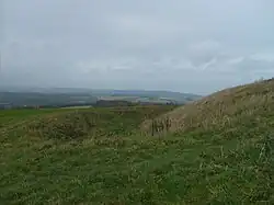 Rampart, ditch and bank of the Trundle Iron Age hillfort