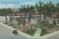 The plaza's extents are seen from above the southwest corner; a jalopy is seen on the left