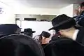 The Ziditchover Rebbe lighting the Hanukkah candles