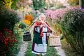 Ukrainian woman wearing traditional dress with carrying yoke