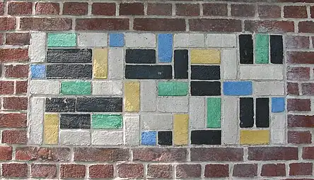 De Stijl - Panel of polychrome bricks on the exterior of the Vakantiehuis De Vonk [nl], a house in Noordwijkerhout, the Netherlands, by Theo van Doesburg, 1917-1919