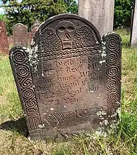 A deaths head winged skull maker dated 1729 and carved by Thomas Johnson Sr. of Cromwell