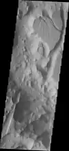 Timbuktu Crater, located on the edge of Capri Chasma.  Image taken with THEMIS.