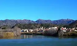 Tivenys over the Ebre river, the serra de Cardó mountain range in the background