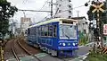 Blue-liveried 7704 in August 2016