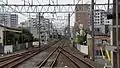 Tokiwadai Station visible from the end of the platforms in April 2016