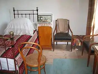 Tolstoy's simple bedroom, as it was when he left the house for the last time in 1910.[citation needed]