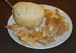 Torta del Casar served with biscuits