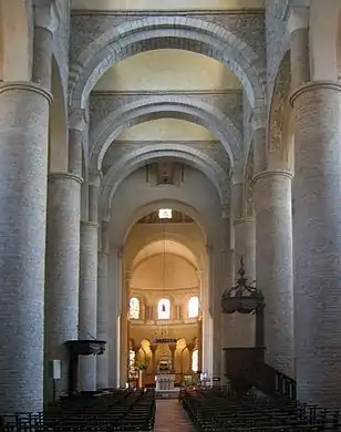 The Church of St Philibert, Tournus, has tall circular piers and is roofed with transverse arches supporting a series of barrel vaults.