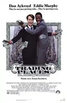 Theatrical release poster showing Dan Aykroyd and Eddie Murphy as their respective characters, with dollar bills in their hands and pockets.