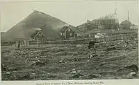 Above-ground portion of the No. 2 Mine with a huge pile of mined ore (early 20th century) next to it. Such heaps were built in winter, as shipping was then at a standstill.