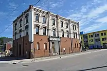 Tremont House, Collingwood, Ontario, circa 2005, abandoned, lower windows boarded and slated for demolition, parapets missing along roofline