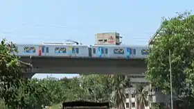 A metro train on an elevated viaduct.