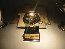 Football-shaped trophy, mounted on a base