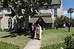 President Donald J. Trump walks with Rev. James R. Harlan, rector of the Church of Bethesda-by-the-Sea, following Easter church service, Sunday, April 1, 2018, in Palm Beach, Florida.