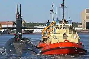 The C-Tractor 3, escorts the U.S. Navy ballistic-missile submarine USS Rhode Island (SSBN-740).