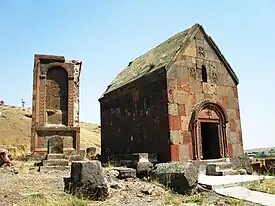 Tukh Manuk shrine with the large khachkar adjacent, while the Surp Grigor Chapel is also seen in the background