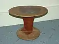 Wooden stool used by Turkana men. Carved from solid wood and conditioned with tobacco juice.