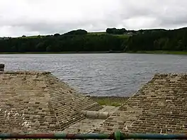 A brick-lined overflow, with a reservoir beyond