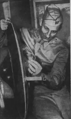 An Army Captain holding a 30-inch hoaxed "flying disc" from Twin Falls, Idaho, July 12, 1947