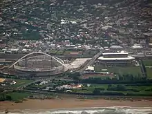 Kings Park Stadium right, in 2009, and the Moses Mabhida Stadium still under construction