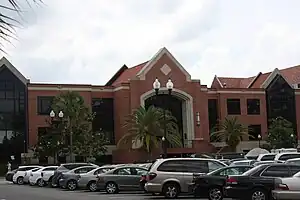 Photo depicts Marshall Criser Hall, a red-brick, concrete and glass building designed in the gothic modern architectural style.