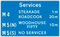 Availability of motorway service areas ahead with distances and names of operators