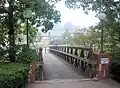 Pedestrian bridge over Slate Run creek heading towards Chambers Hall