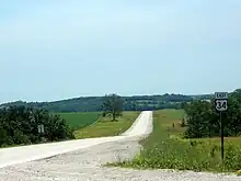 A road in a grassy field