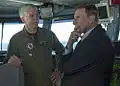 Capt. Karl Thomas, commanding officer of the Nimitz-class aircraft carrier USS Carl Vinson, speaks with U.S. Rep. John Mica, from Florida, in the navigation bridge aboard the Nimitz-class aircraft carrier USS Carl Vinson on 22 October 2014. Carl Vinson and its embarked air wing, Carrier Air Wing 17, are deployed in the U.S. 5th Fleet area of operations supporting Operation Inherent Resolve, strike operations in Iraq and Syria as directed, maritime security operations, and theater security cooperation efforts in the region.