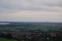 View over flat landscape with a patchwork of fields.