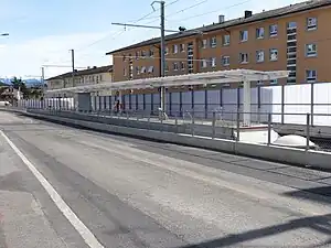 Island platform next to roadway