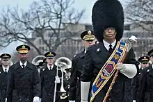 The U.S. Army Field Band at parade rest with drum-major in front.