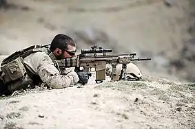 A SEAL takes up a defensive position in a village in northern Zabul province, Afghanistan, 10 April 2010