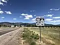 Approaching northern end of SR64. Eastbound US 50 arrives at a T-intersection at the edge of Holden and turns left, and the SR 64 is to the right (May 2020)