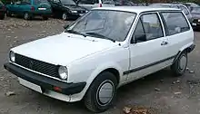  Front-three-quarter view of a small three-door car.